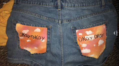 Lexani Brown shows off her shorts that she decorated with song lyrics.