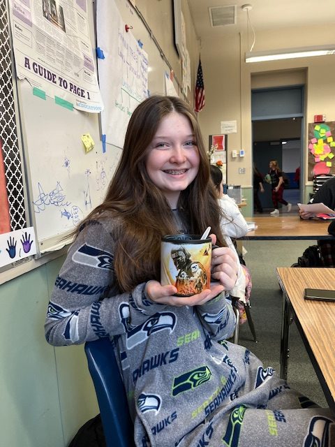 Brenna Freese rocking her pajama day outfit, complete with her favorite mug