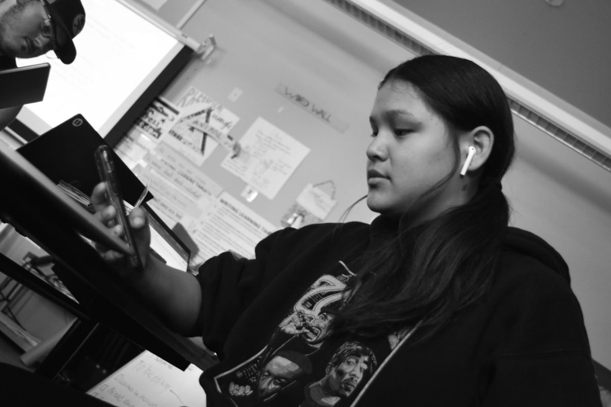 Shelby Hernandez posing for a photo for a Phones in the classroom Story. 
