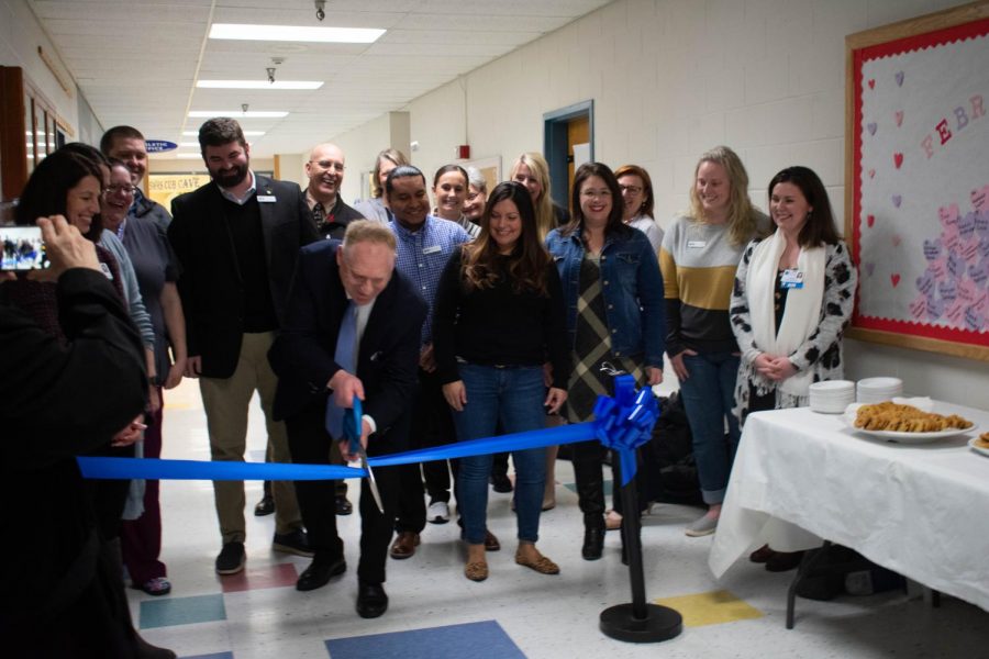 Sedro-Woolley+School+District+members+gather+around+on+February+24+as+Superintendent+Phil+Brockman+cuts+the+Ribbon+for+the+new+Woolley+Wellness+Center.+