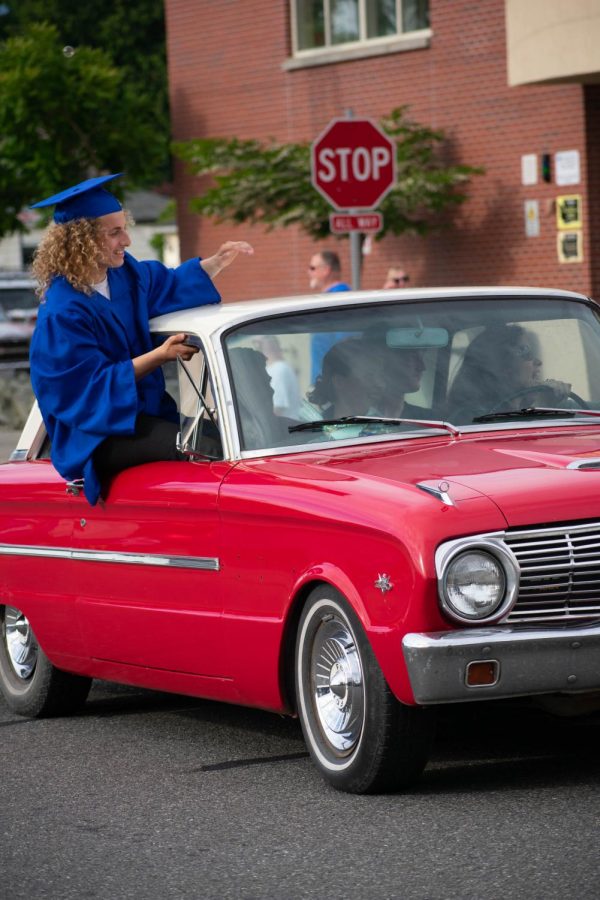 Jens Gifford waves during the 2020 Parade of Graduates June 5, 2020 in front of Sedro-Woolley High School.