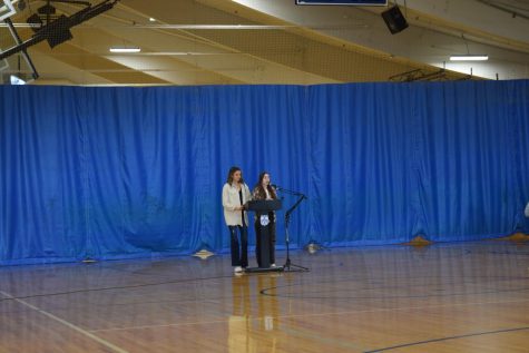 Current ASB president Jamie Bartok (12) and vice president Lily Devries (12) announce the winners of each ASB position 