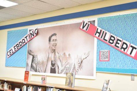 A photograph of storyteller and linguist Vi Hilbert hangs on the library 
