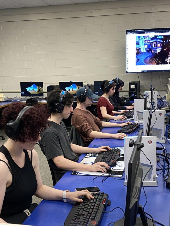 A group of esports team members practice for an upcoming competition.