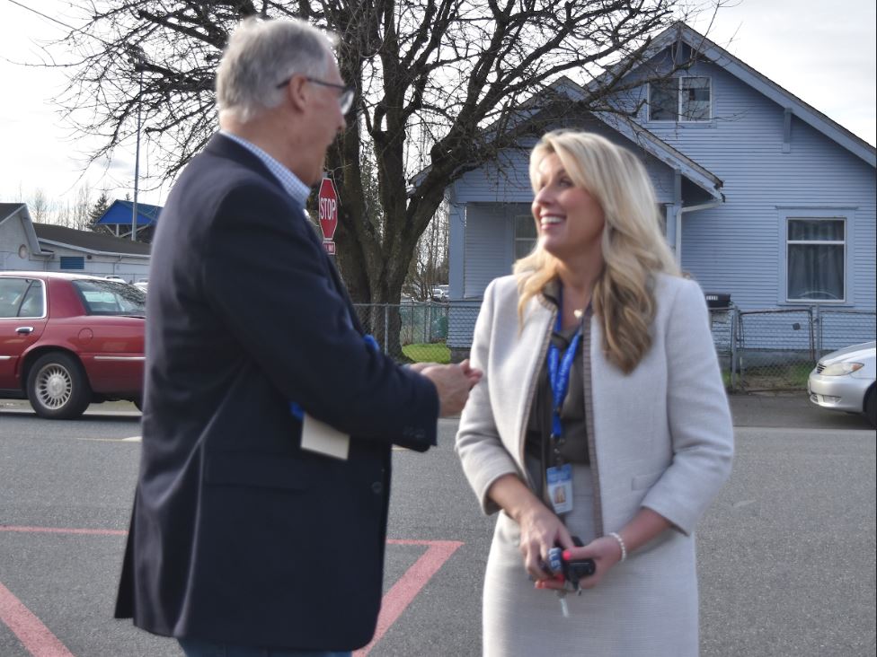 Principal Kerri Carlton and  Governor Jay Inslee having a conversation. Inslee made a visit to Sedro-Woolley High School on February 2 to visit his friend Reed. Both Reed and Inslee were on the winning team for the state basketball championship in 1969.