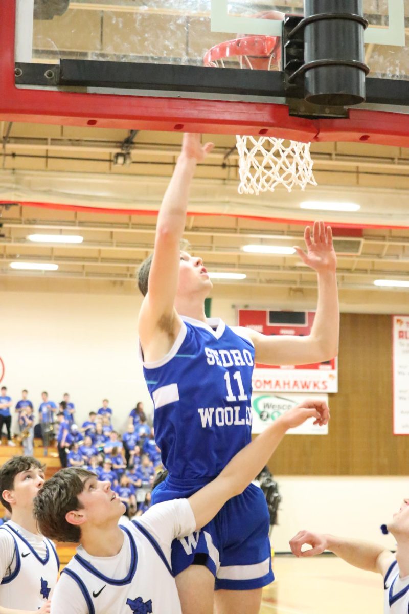 Ethan DeJong goes up for a layup in the final playoff game on February 22, in Marysville-Pilchuck.