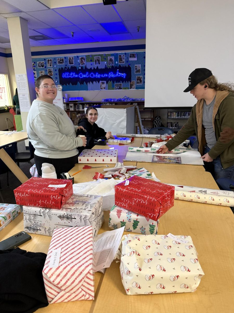 Students help wrap presents for winter wishes